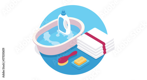 A baby bathtub filled with water and soap is ready for bath time with clean towels and a brush nearby.