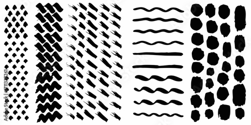 Collection of hand drawn black brush stroke elements and textures on white background