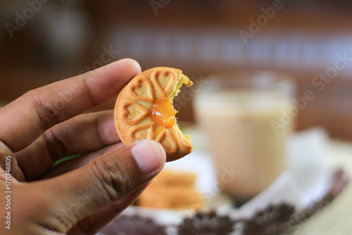 Breakfast and snack menu. Butter biscuits with pineapple jam and a glass of chocolate milk. Close-up of butter cookies and a glass of chocolate, sweet cakes. Perfect for recipes, articles, catalogs.