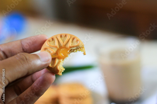 Breakfast and snack menu. Butter biscuits with pineapple jam and a glass of chocolate milk. Close-up of butter cookies and a glass of chocolate, sweet cakes. Perfect for recipes, articles, catalogs.