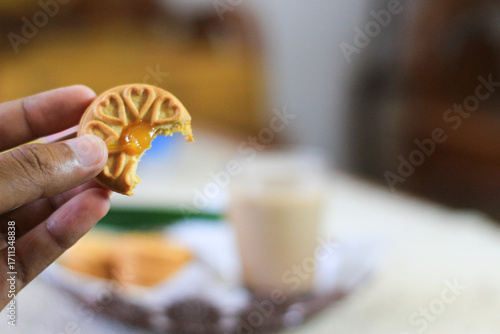 Breakfast and snack menu. Butter biscuits with pineapple jam and a glass of chocolate milk. Close-up of butter cookies and a glass of chocolate, sweet cakes. Perfect for recipes, articles, catalogs.