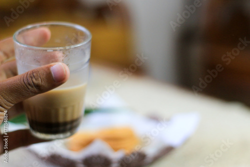 Breakfast and snack menu. Butter biscuits with pineapple jam and a glass of chocolate milk. Close-up of butter cookies and a glass of chocolate, sweet cakes. Perfect for recipes, articles, catalogs.