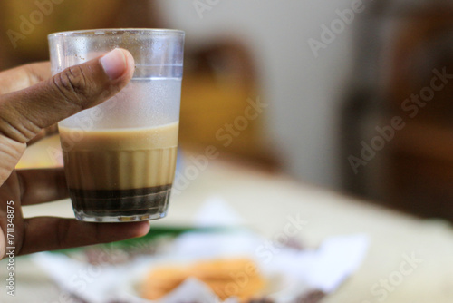 Breakfast and snack menu. Butter biscuits with pineapple jam and a glass of chocolate milk. Close-up of butter cookies and a glass of chocolate, sweet cakes. Perfect for recipes, articles, catalogs.