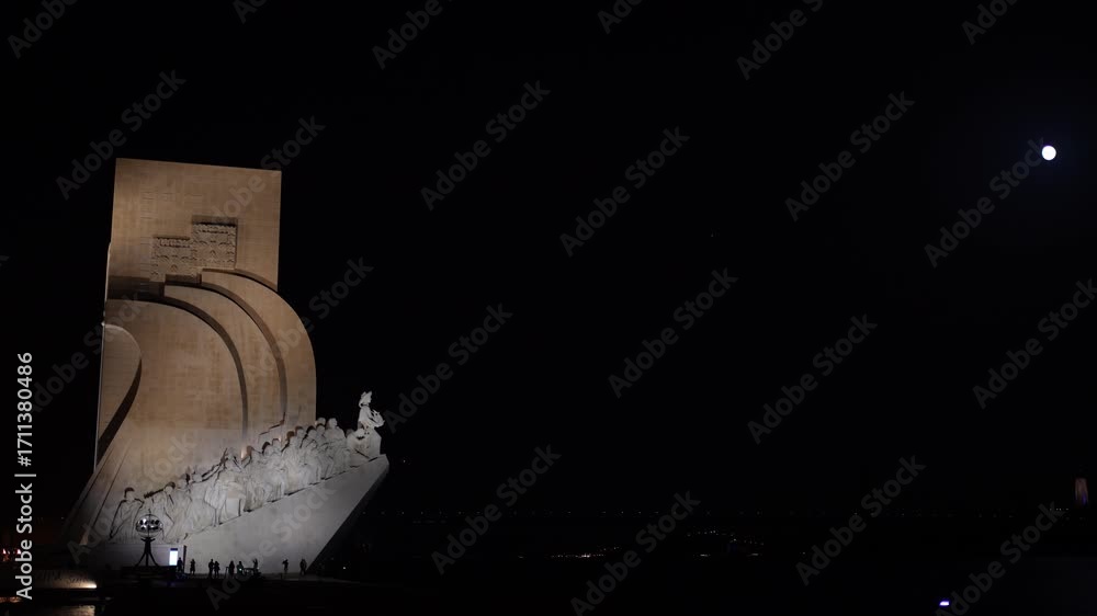 illuminated Monument to the Discoveries or Padrao dos Descobrimentos at the bank of Tagus River at Belem district at night.