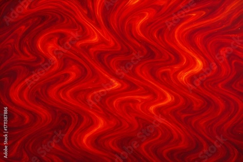 Vibrant red and orange abstract background with swirling patterns evokes passion and energy for creative projects