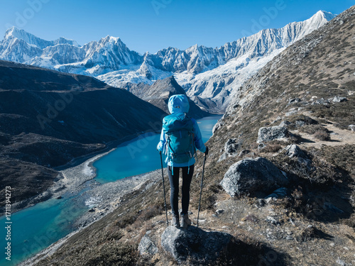 Successful woman hiker on high altitude mountain top
