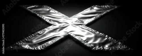 Silver metallic X shape with draped fabric texture on dark background