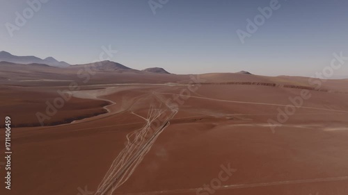 Aerial shot of the majestic mountains and volcanoes in the Atacama highlands captured in summer under clear skies showing the vast and remote beauty of the Chilean altiplano