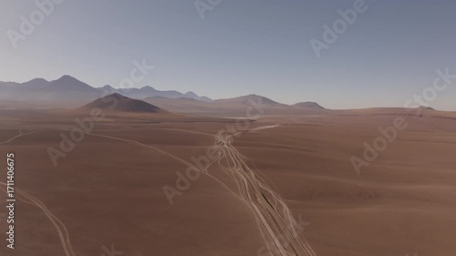 Aerial shot of the majestic mountains and volcanoes in the Atacama highlands captured in summer under clear skies showing the vast and remote beauty of the Chilean altiplano