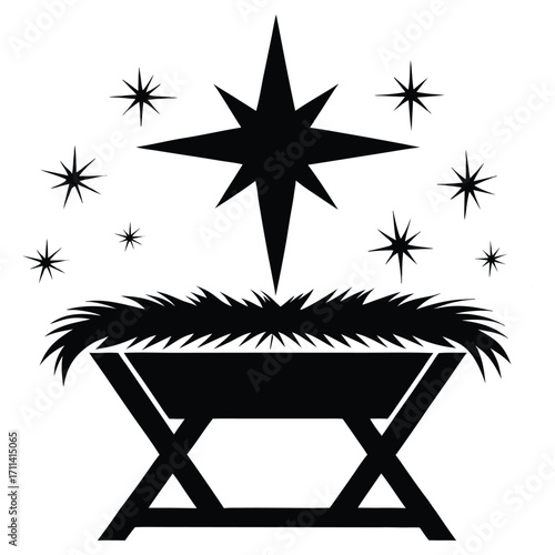 A black silhouette of a baby Jesus in a manger
