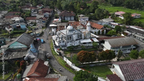 Aerial view of Mosque in the Middle of a Highland Village from Above