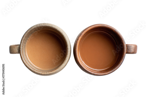 Two mugs of light brown liquid, likely tea or coffee, side-by-side