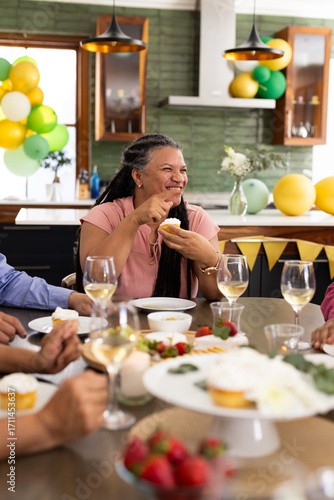 Wallpaper Mural At party, senior woman having cupcake and chatting with friends Torontodigital.ca