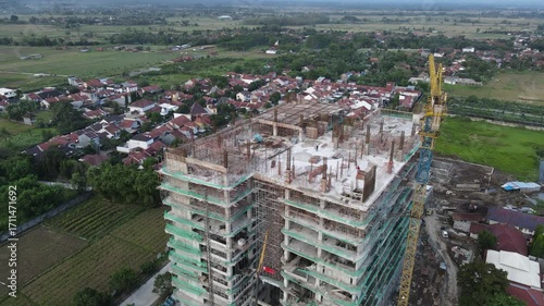 Aerial Drone Footage of Construction Activity in an Unfinished Building from Above