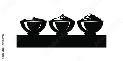 chicken soup  and food Three black bowls with textured toppings