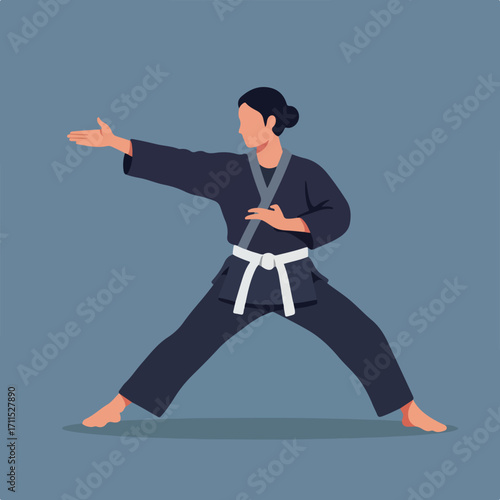Woman in dark uniform, white belt, arms extended practicing martial arts stance on blue backdrop