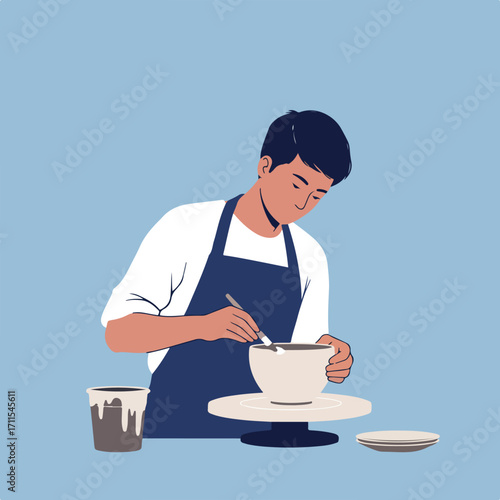 Potter working on a bowl with brush and wheel, wearing an apron; light blue background