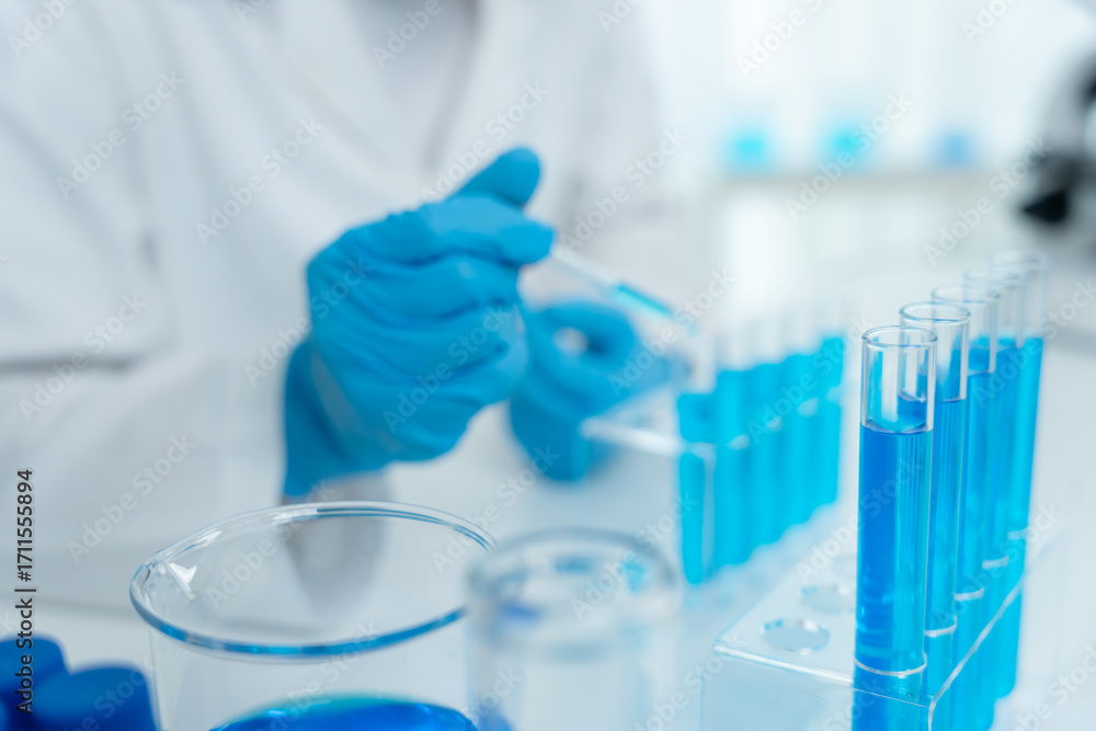 Fototapeta premium Scientist analyze biochemical samples in advanced scientific laboratory. Medical professional use dropper mix microbiological developmental of viral. Biotechnology research in science lab. cosmetic