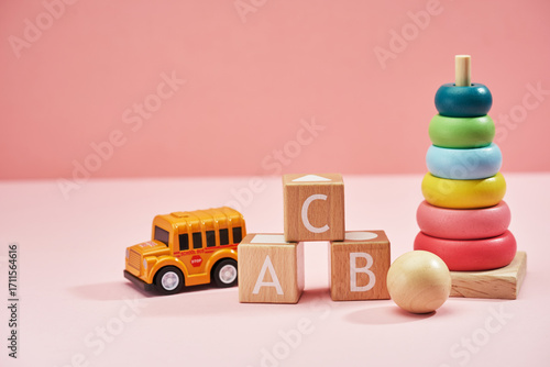 baby toys against pink background