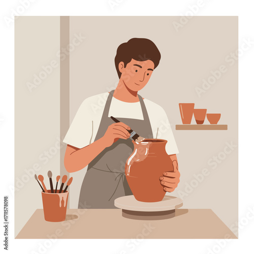 Potter with brush glazes clay vase on wheel in studio. Muted earth tones art background