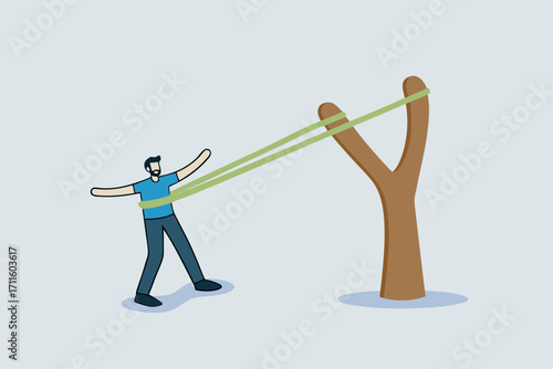 boost career development, The courageous entrepreneur stretches the rubber band in preparation to shoot the slingshot into the air