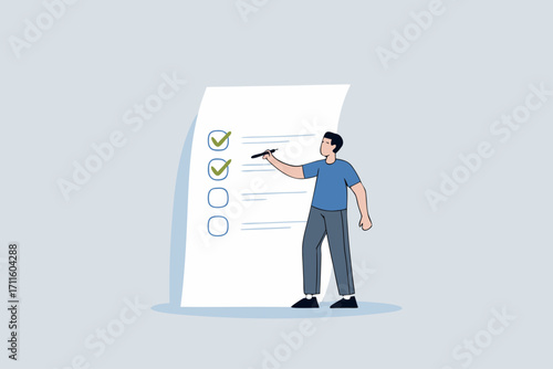 Completed checklist, Businessman is using a pen to review the project list and tick off the checkbox labeled as completed