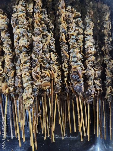 Indonesian Mussel Satay is a savory Indonesian delicacy made from tender, spiced mussels skewered and grilled or stir-fried, bursting with rich, aromatic flavors of garlic, chili, and traditional herb