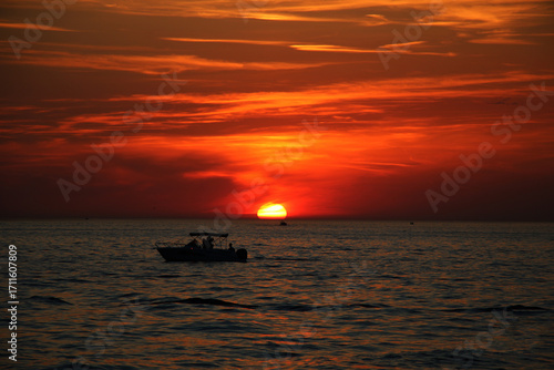 sunset, boat, sea, water, sun, sky, ocean, sunrise, beach, fishing, landscape, travel, evening, nature, silhouette, lake, orange, ship, summer, coast, horizon, clouds, wave, dusk, cloud