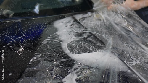 Applying a Protective Film on the Surface of Your Car for Enhanced Durability and Shine