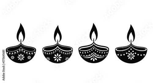 Four ornate diwali diyas with flames illuminated for festive celebrations vector