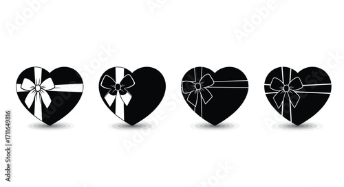 Four black heart shaped gift boxes with ribbons tied for valentine's day or romance occasions vector