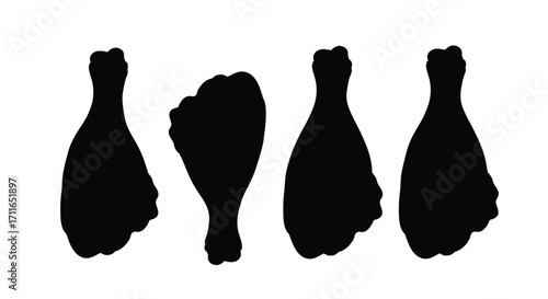 Four black silhouettes of fried chicken legs isolated on a representing food vector