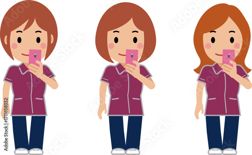 スマホを見るえんじ色の制服の女性看護師