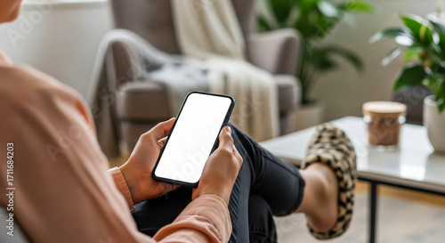 Wallpaper Mural Relaxing at Home: Woman Using Smartphone with Blank Screen Torontodigital.ca