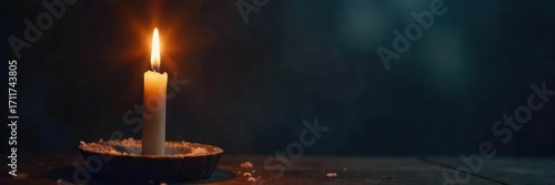 A single, flickering candle flame illuminates a cross, symbolizing hope, faith, and spiritual redemption in the darkness Perfect for religious, spiritual, or inspirational themes , religion, comfort