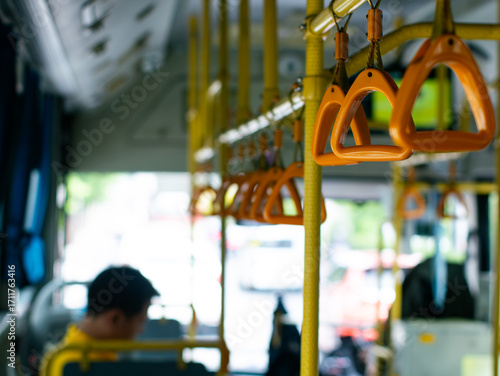 Schilderij op canvas Passenger handholds and grab bars inside public transportation bus or train - safety support handles for commuters in urban transit vehicle