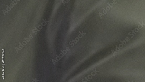 Abstract dark gray and olive green fabric texture with soft folds