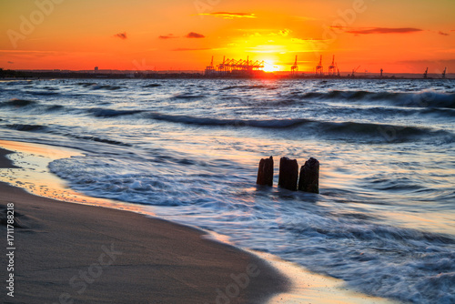 Fototapeta Naklejka Na Ścianę i Meble -  Sunset over the Baltic Sea beach in Gorki Zachodnie, Gdansk. Poland