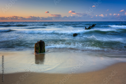 Fototapeta Naklejka Na Ścianę i Meble -  Sunset over the Baltic Sea beach in Gorki Zachodnie, Gdansk. Poland