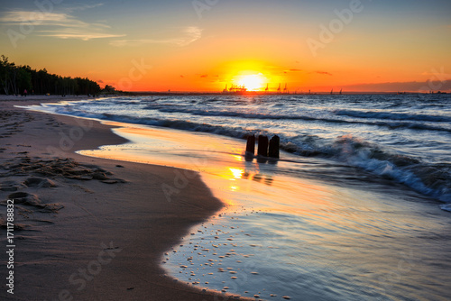 Fototapeta Naklejka Na Ścianę i Meble -  Sunset over the Baltic Sea beach in Gorki Zachodnie, Gdansk. Poland