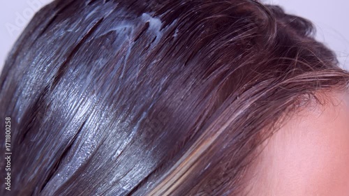 Hair with applied hair care product, balm, mask.