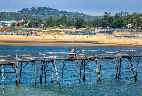 Ong Cop (Mr. Tiger) wooden bridge across Phu Ngan river in Song Cau, Phu Yen - one of the longest wooden bridges in central Vietnam - can be a shortcut to the famous Ganh Da Dia scenic spot