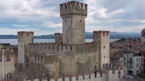 Wallpaper Mural Cloudy Sunrise Over Scaligero Castle of Sirmione, Lake Garda, Italy – Medieval UNESCO Heritage Captured in Drone Video Torontodigital.ca