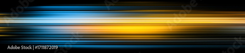 Blurry yellow and blue light streaks on abstract background