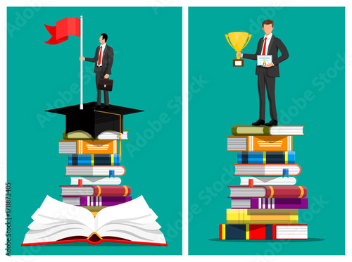 Businessman success after education, standing on book stack. Man holding red flag on graduation cap, holding trophy, diploma. Learning career growth.
