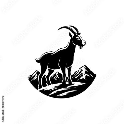 Mountain goat standing on rocky alpine pasture, symbolizing wilderness, strength, resilience, nature and outdoor adventure.
