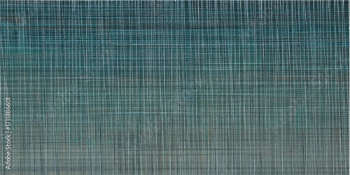 Textured blue and green abstract seamless patterns create a vintage cloth wallpaper design with intersecting lines on a grunge background