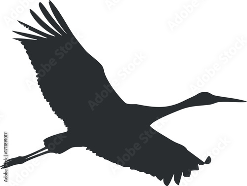 A graceful silhouette of a crane in flight against a clean background.
