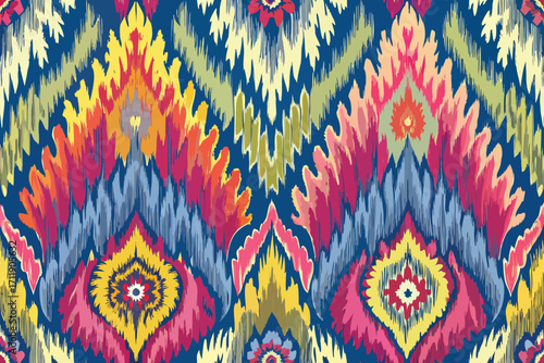 Vector art of vibrant ikat pattern with colorful geometric shapes and brush strokes on a dark blue background