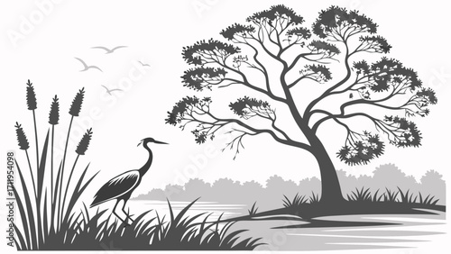 Silhouette of a heron standing by a lake with reeds tall grass a tree and birds flying overhead.
